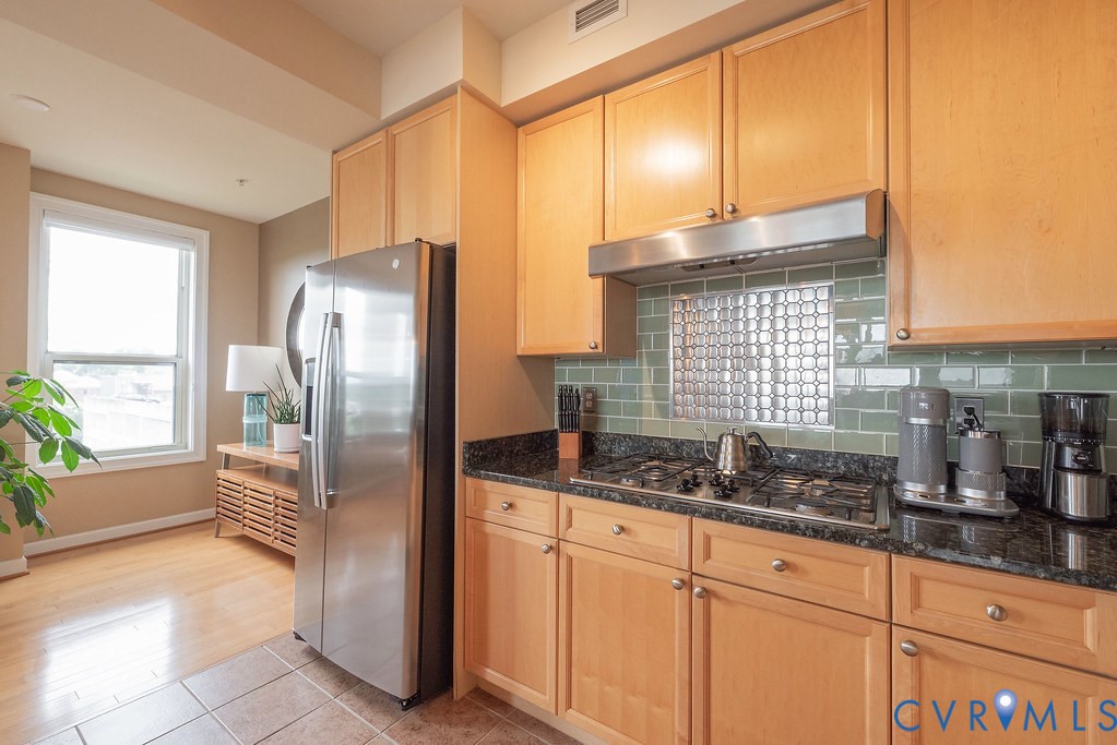 4820 Old Main Street, Unit 511 Henrico, VA 23231 - Photo 14 of 51 a kitchen with granite countertop a refrigerator and a sink
