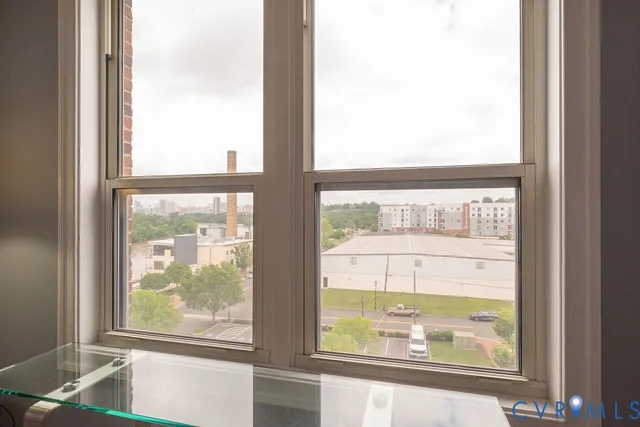 a balcony with table and chairs