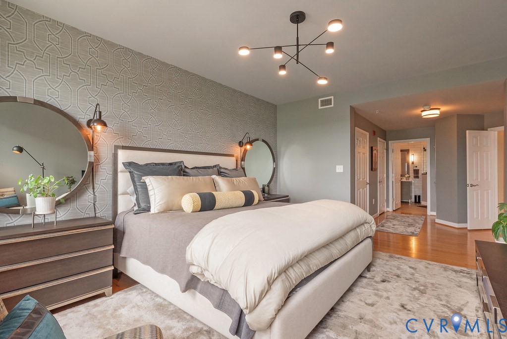 4820 Old Main Street, Unit 511 Henrico, VA 23231 - Photo 28 of 51 a bedroom with double bed and a chandelier