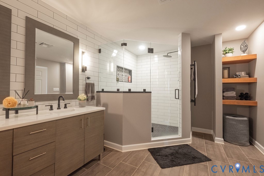 4820 Old Main Street, Unit 511 Henrico, VA 23231 - Photo 30 of 51 a bathroom with a sink a toilet and shower
