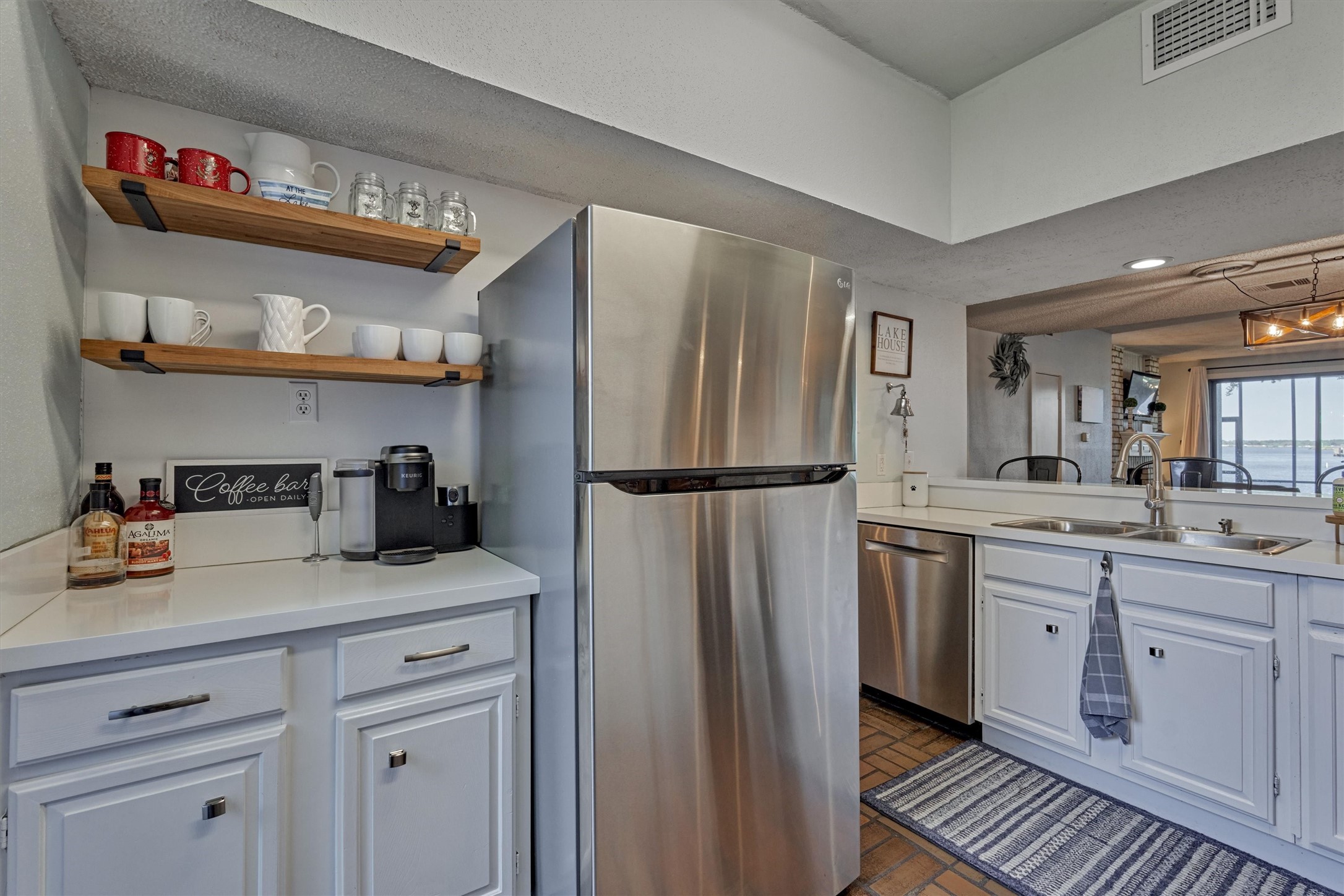 1428 Bowsprit Point Willis, TX 77318 - Photo 13 of 47 An additional coffee bar area in the kitchen is a great use of space!