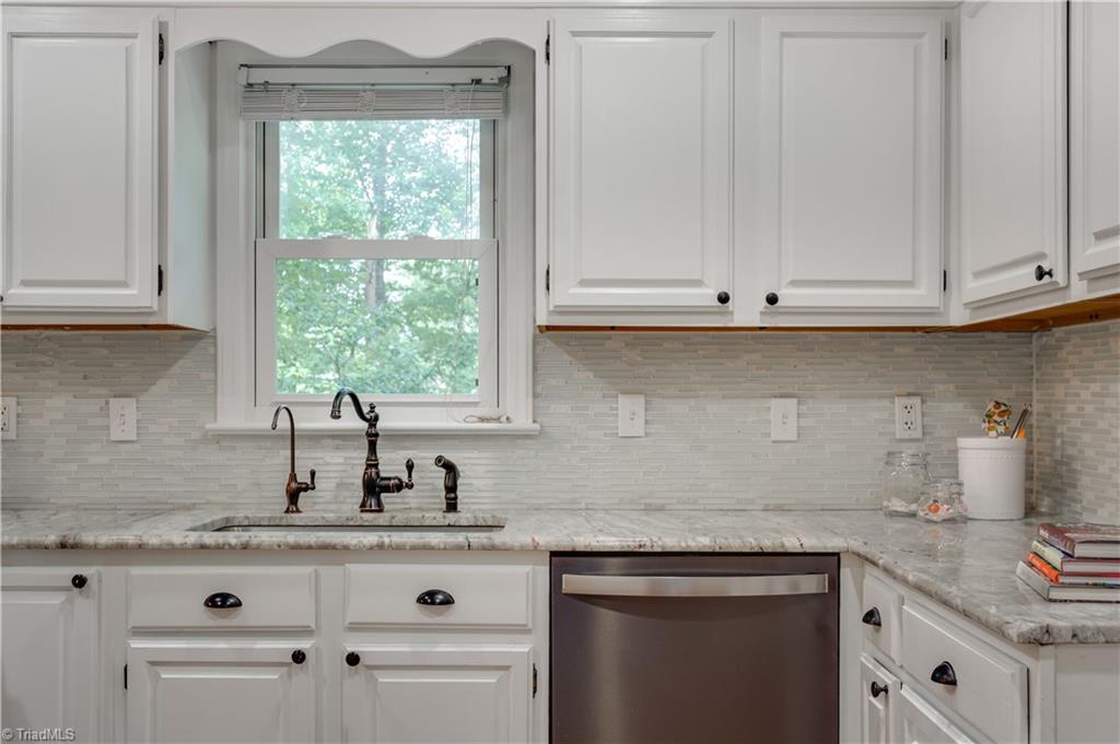 7004 Ridge Haven Road Greensboro, NC 27410 - Photo 11 of 29 Eat-In Area with Bar Stool Counter Space!