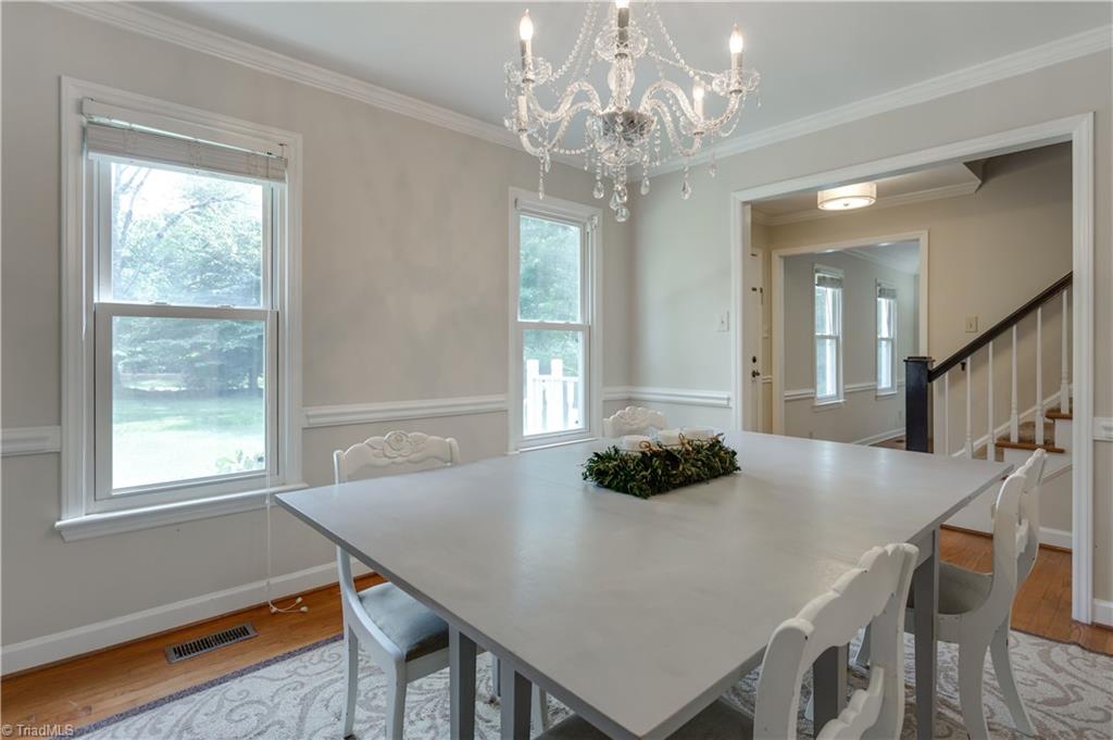 7004 Ridge Haven Road Greensboro, NC 27410 - Photo 8 of 29 Updated Kitchen with Beautiful Granite Countertops and Light Backsplash, as well as White Cabinets!