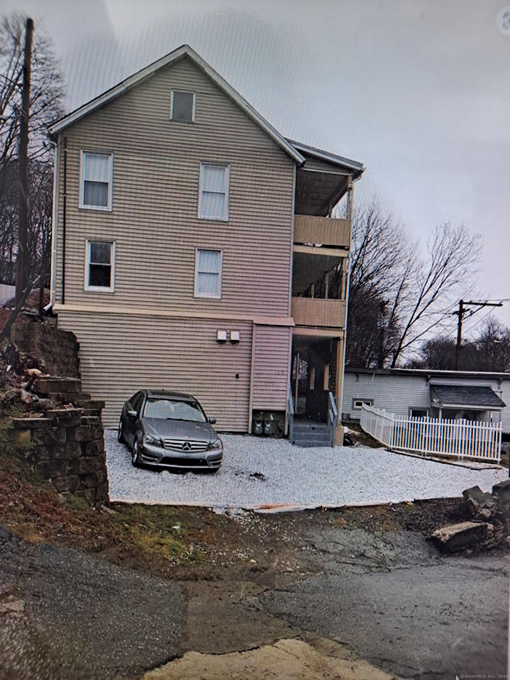 a front view of a house with parking space