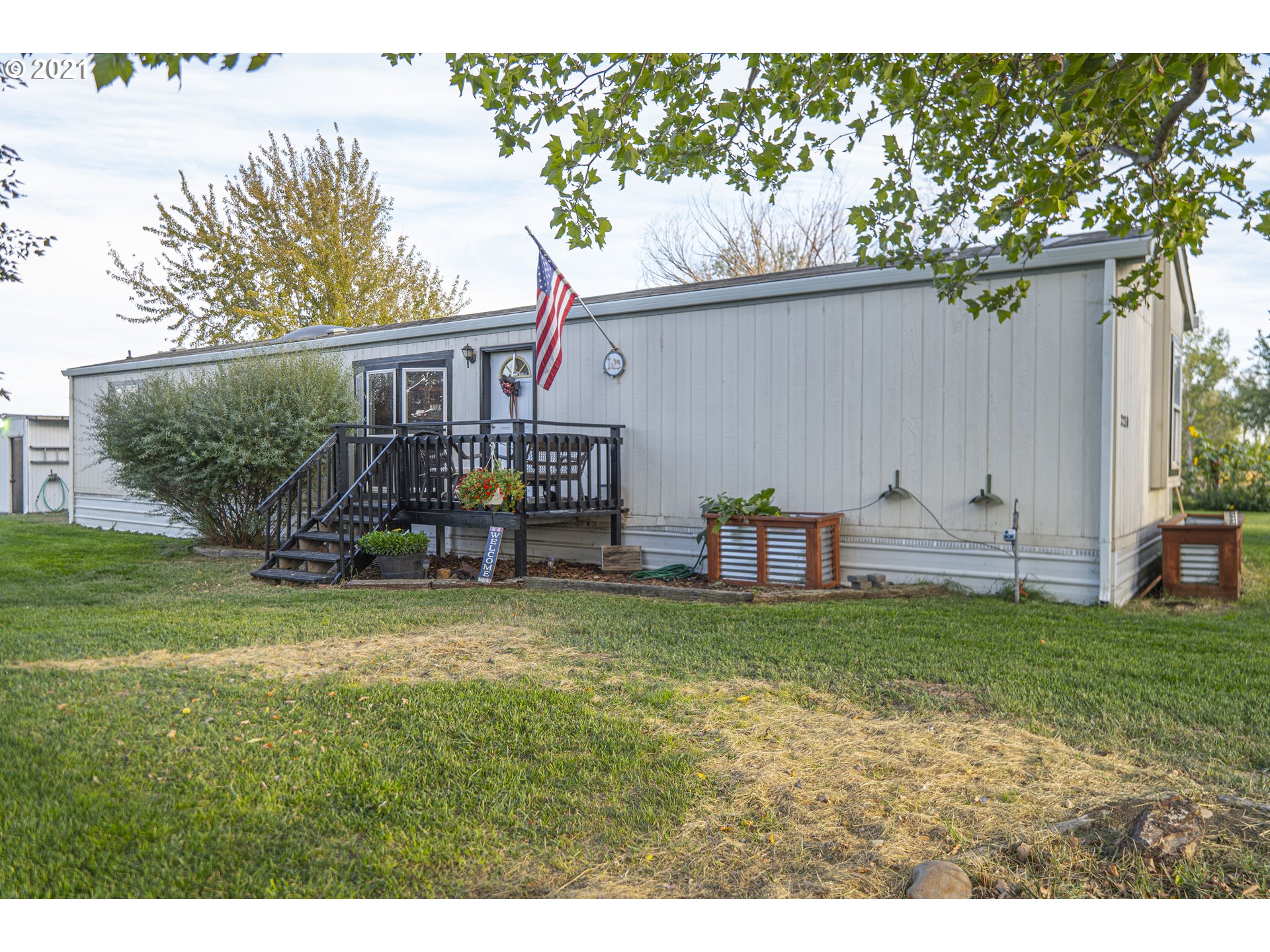 2230 North Ott Road Hermiston, OR 97838 - Photo 1 of 32 a view of a backyard with table and chairs and a fire pit