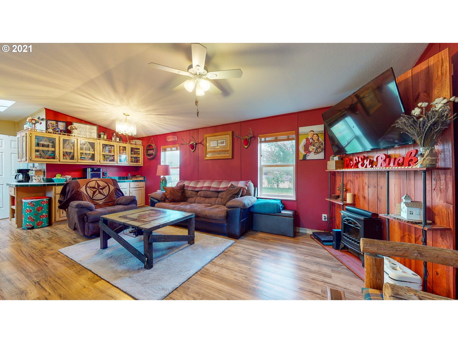 2230 North Ott Road Hermiston, OR 97838 - Photo 3 of 32 a living room filled with furniture and a flat screen tv