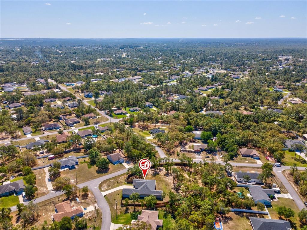 11981 Robina Road Weeki Wachee, FL 34614 - Photo 67 of 93 an aerial view of residential houses with city view