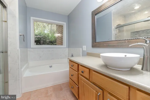 a bathroom with a bathtub and a sink