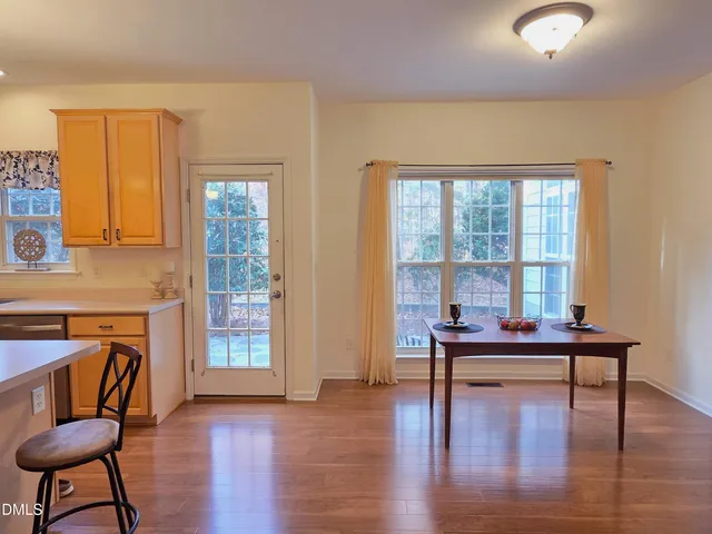 a workspace with furniture window and wooden floor