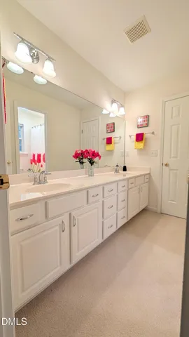 a kitchen with cabinets a sink and white appliances