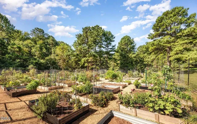 a view of a lake with lawn chairs