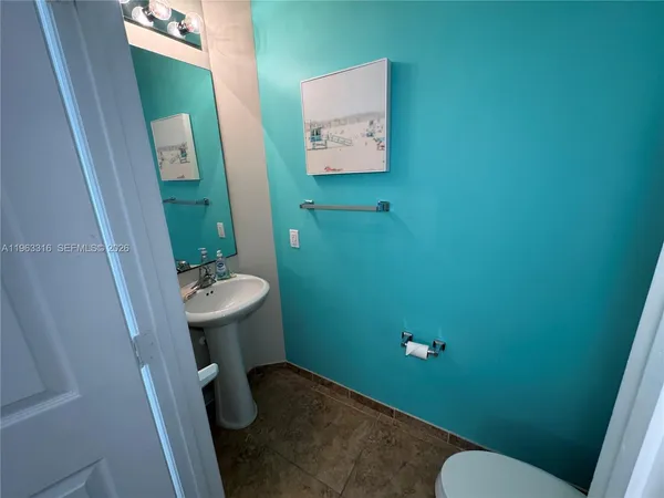 a bathroom with sink and toilet