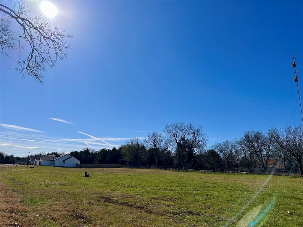 Lot 5 Rosemound Street Commerce, TX 75428 - Photo 4 of 5 a view of a lake with sunset view