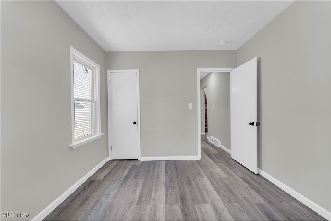 4124 Bayard Road Cleveland, OH 44121 - Photo 17 of 35 Unfurnished bedroom with baseboards and light wood-type flooring
