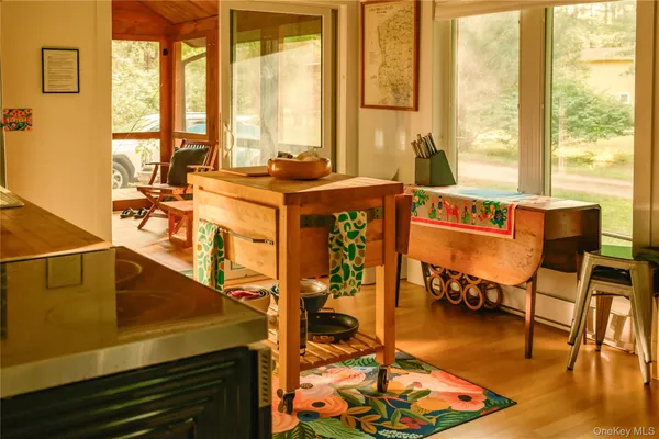 a bedroom with furniture and a large window