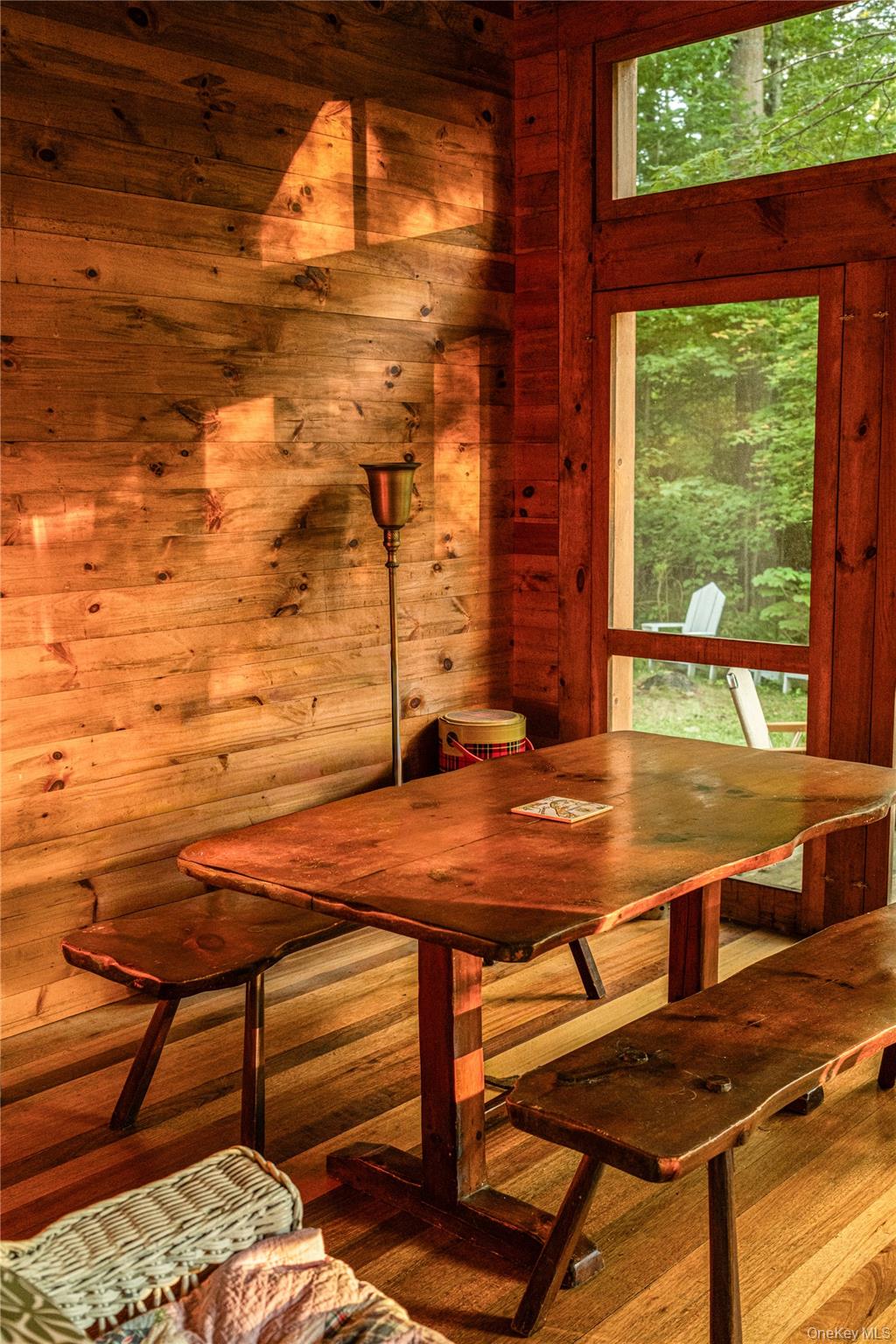 127 Queechy Shore Beach Road Canaan, NY 12029 - Photo 20 of 36 a view of a backyard with table and chairs and wooden floor