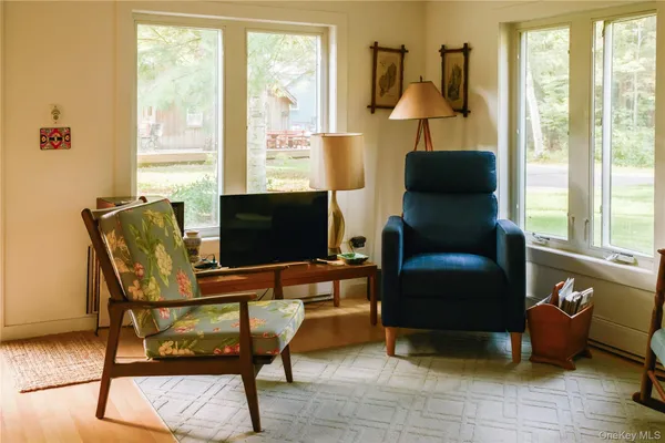 a living room with furniture and a window