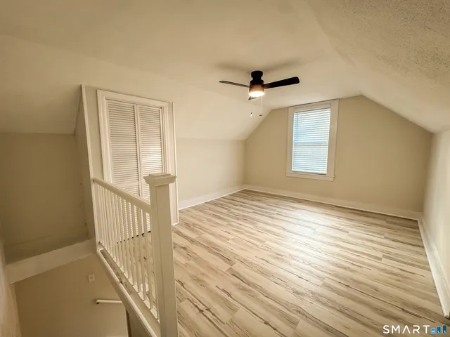 a view of a livingroom with wooden floor