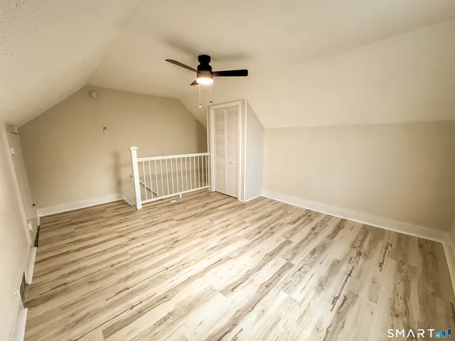 a view of a balcony with wooden floor