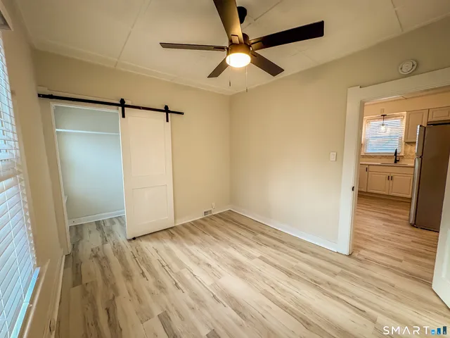 a view of a livingroom with wooden floor