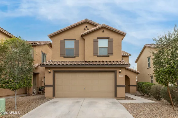a view of a house with a garage