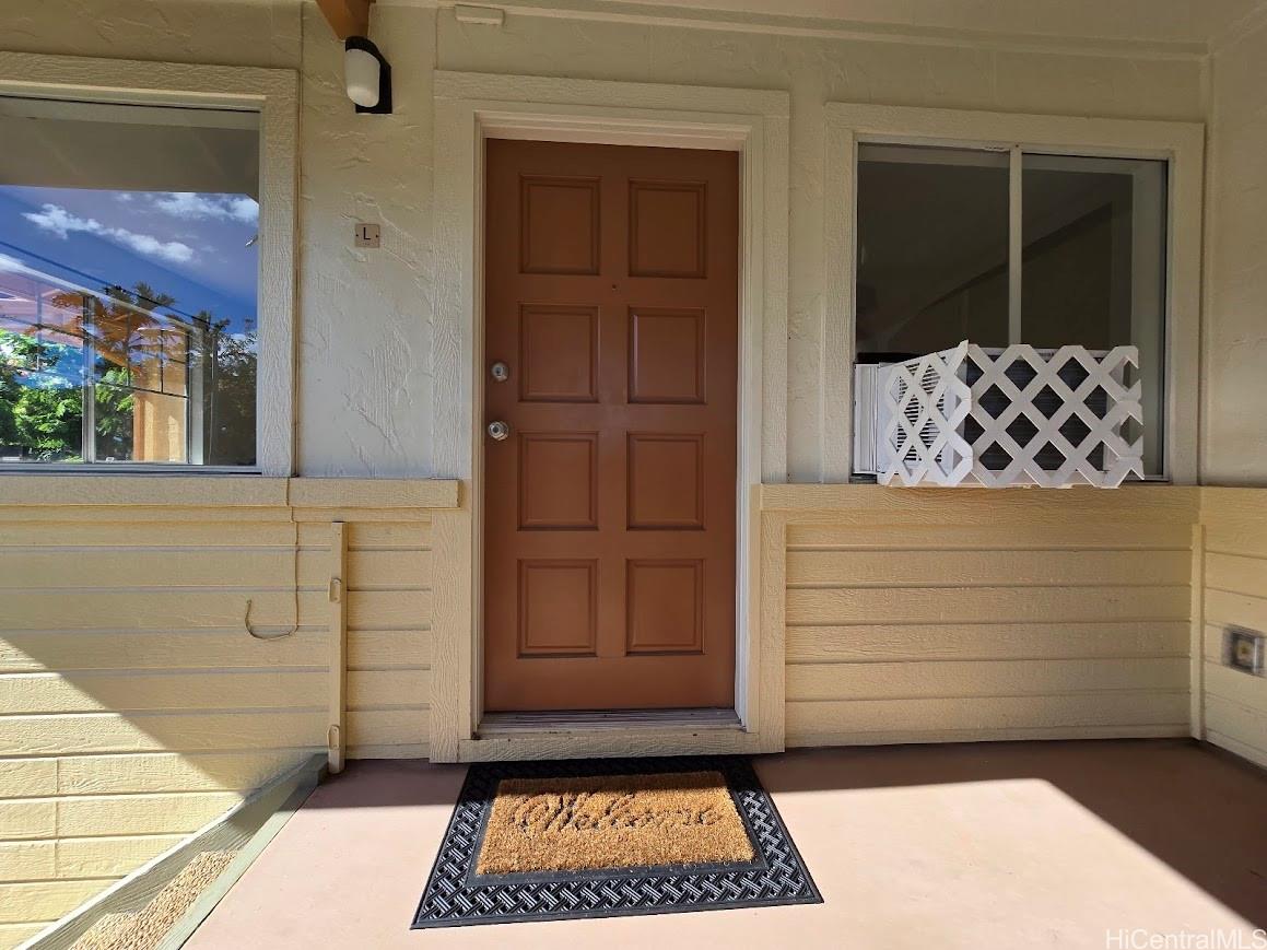 91-1109 Namahoe Street, Unit 1L Kapolei, HI 96707 - Photo 2 of 18 a view of a door of the house