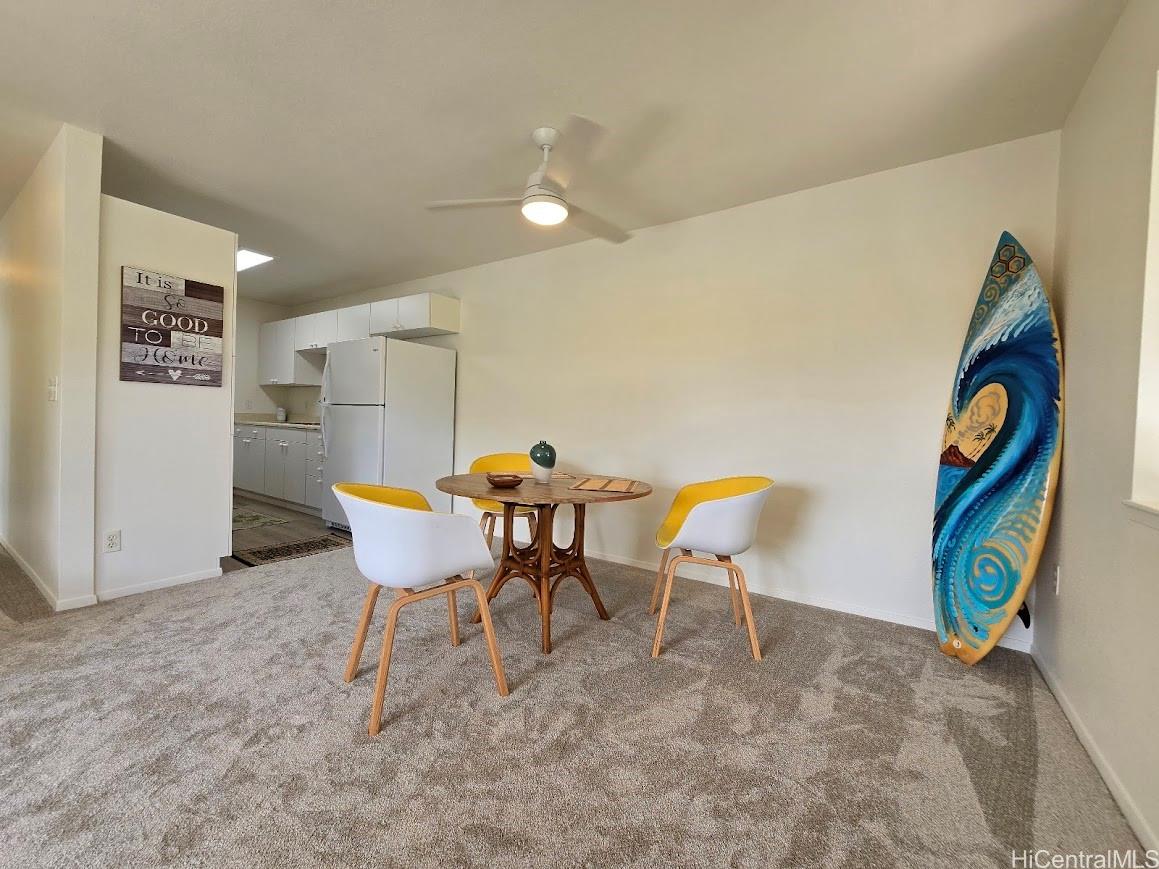 91-1109 Namahoe Street, Unit 1L Kapolei, HI 96707 - Photo 5 of 18 a view of a dining room with furniture