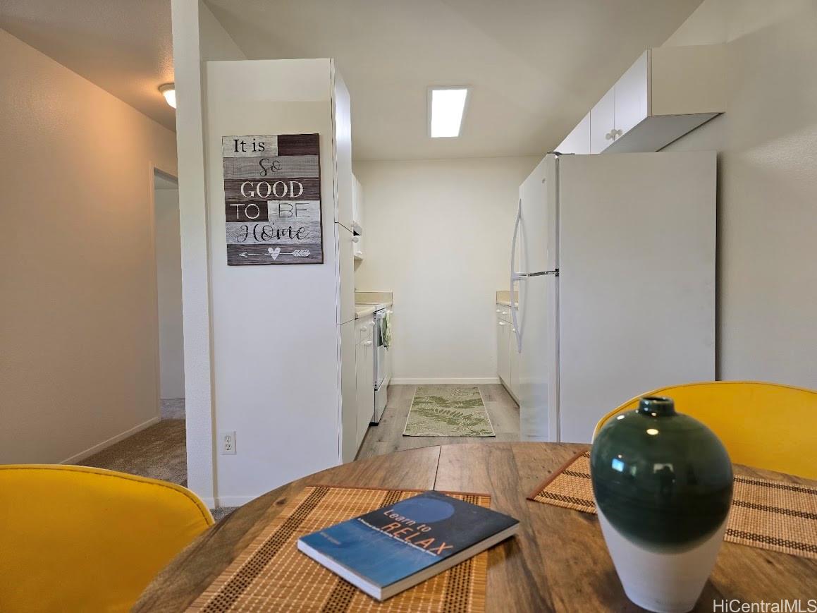 91-1109 Namahoe Street, Unit 1L Kapolei, HI 96707 - Photo 6 of 18 a living room with a bed and furniture