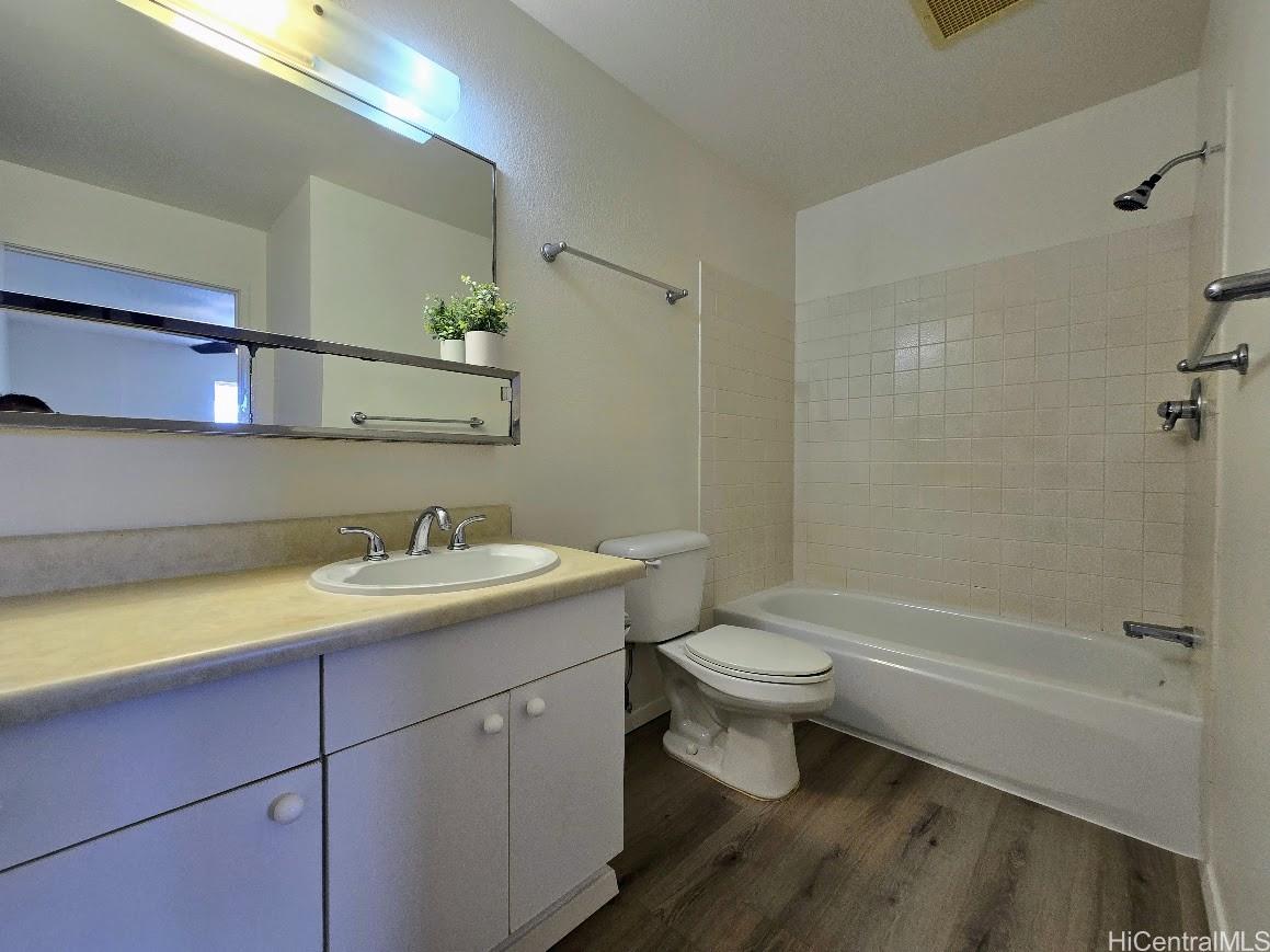 91-1109 Namahoe Street, Unit 1L Kapolei, HI 96707 - Photo 10 of 18 a bathroom with a sink a toilet and shower