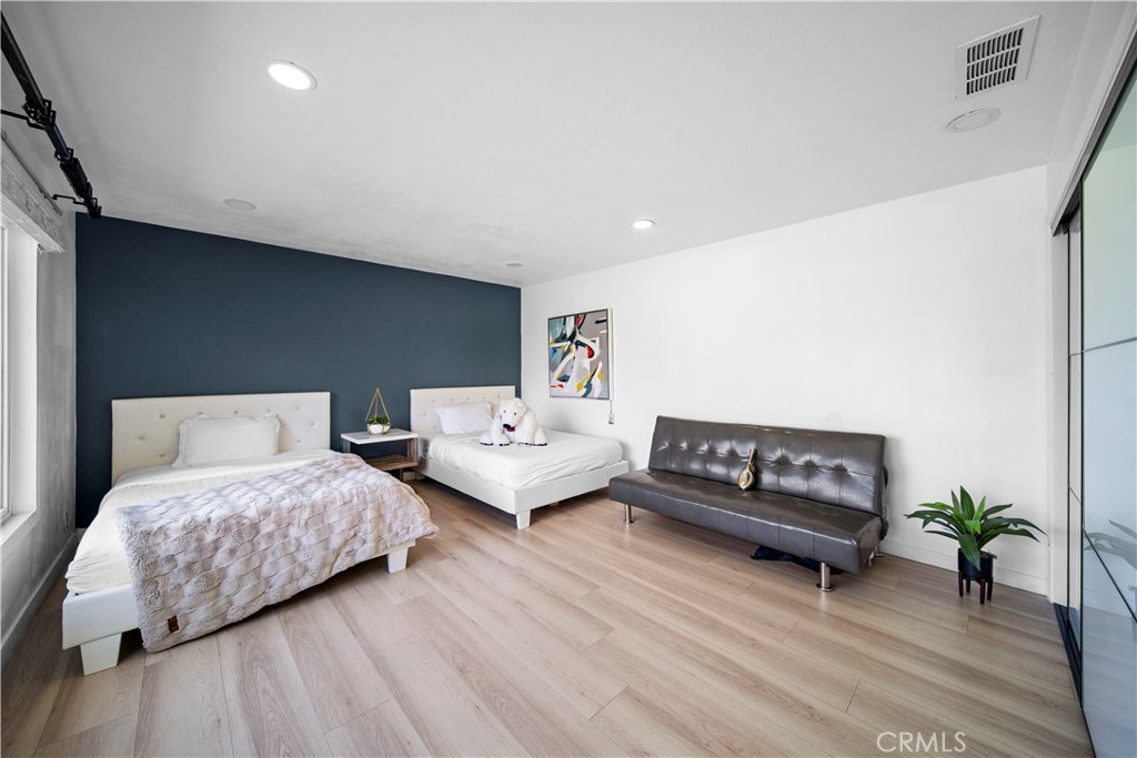 1158 North Ivescrest Avenue Covina, CA 91724 - Photo 14 of 27 a bedroom with two beds and a couch