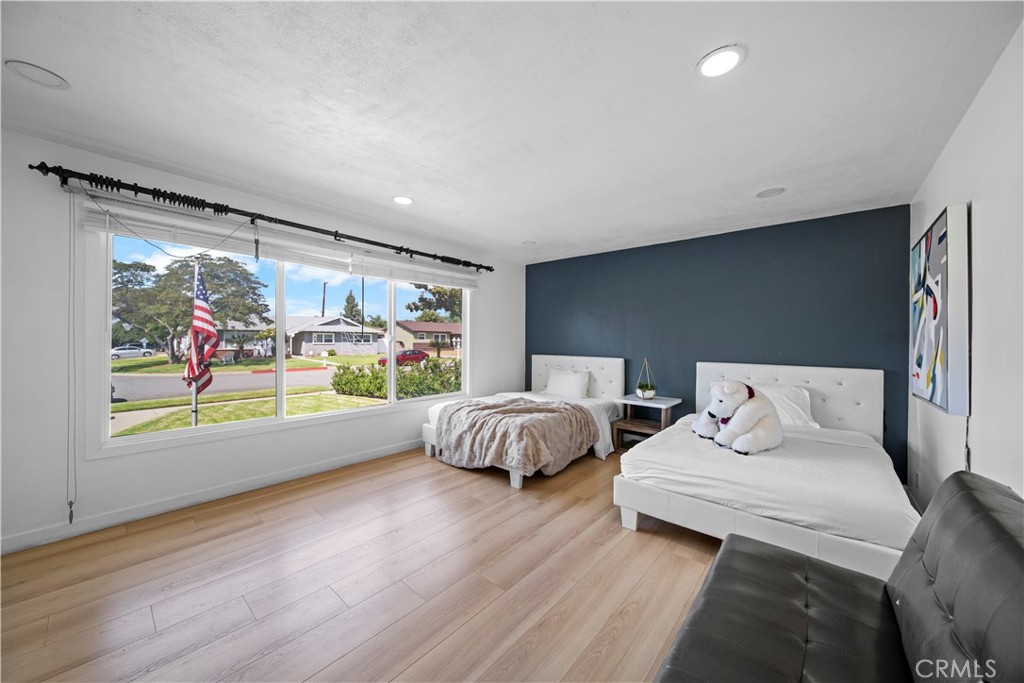 1158 North Ivescrest Avenue Covina, CA 91724 - Photo 15 of 27 a bed room with two bed and painting on the wall