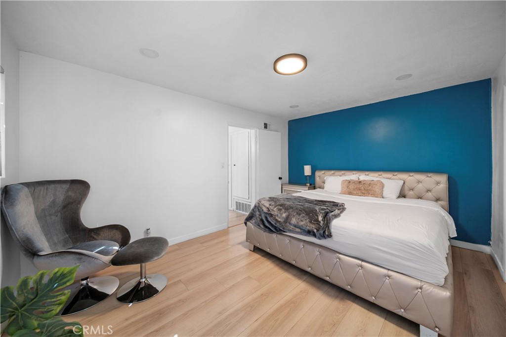 1158 North Ivescrest Avenue Covina, CA 91724 - Photo 19 of 27 a bedroom with a bed and chair