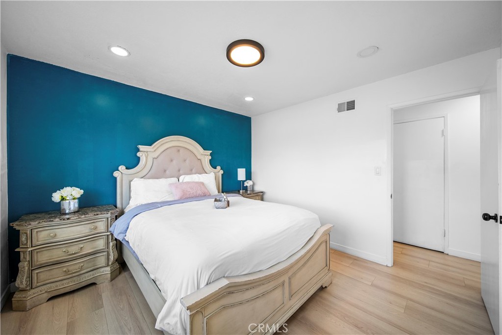 1158 North Ivescrest Avenue Covina, CA 91724 - Photo 23 of 27 a bedroom with a bed and a painting on the wall