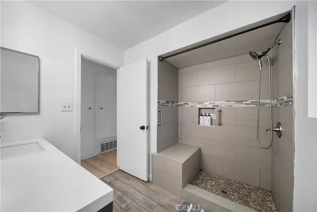 a bathroom with a sink and shower