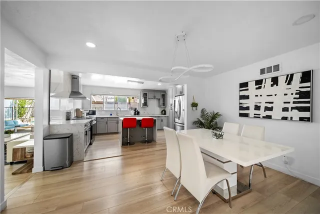 a living room with furniture and kitchen view