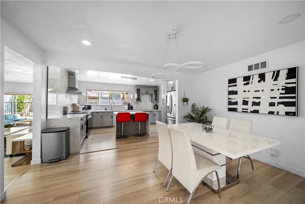 1158 North Ivescrest Avenue Covina, CA 91724 - Photo 4 of 27 a living room with furniture and kitchen view