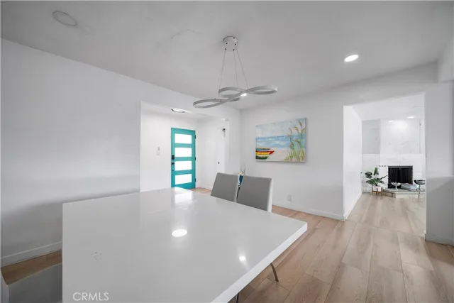 a view of a living room and dining room