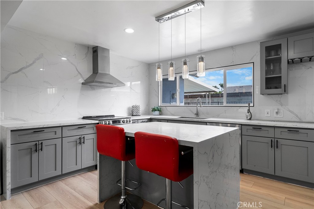 1158 North Ivescrest Avenue Covina, CA 91724 - Photo 10 of 27 a kitchen with stainless steel appliances a sink and a refrigerator