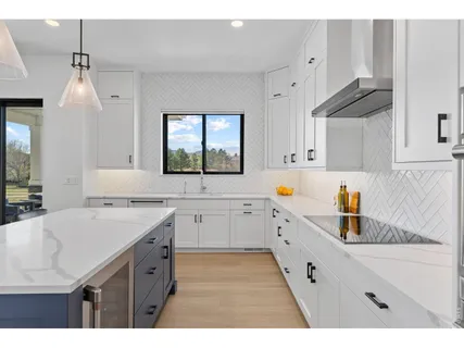 a kitchen with a sink and cabinets