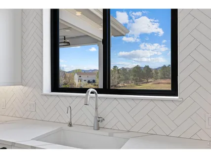 a view of a living room with a large window
