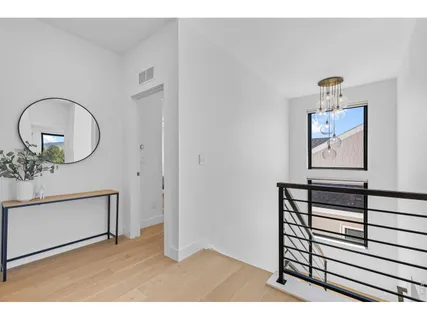 a bedroom with a bed and large window