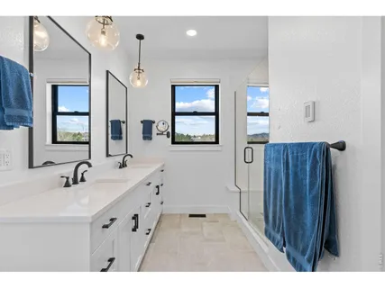 a bathroom with a granite countertop shower