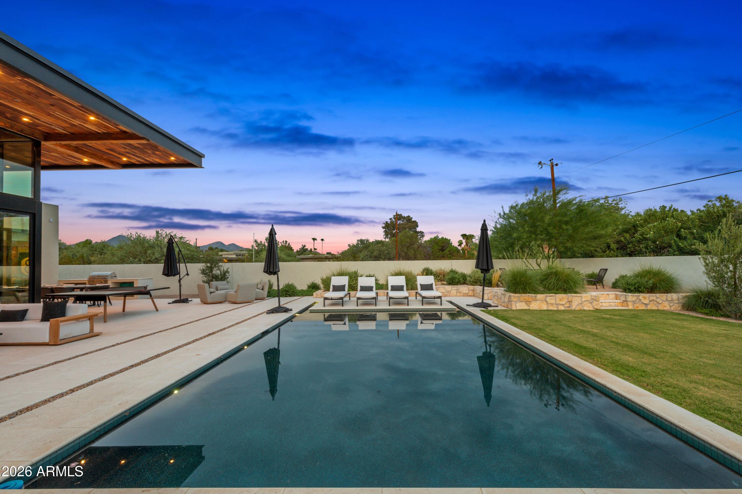 8307 East Gary Road Scottsdale, AZ 85260 - Photo 31 of 34 a view of a swimming pool with a patio