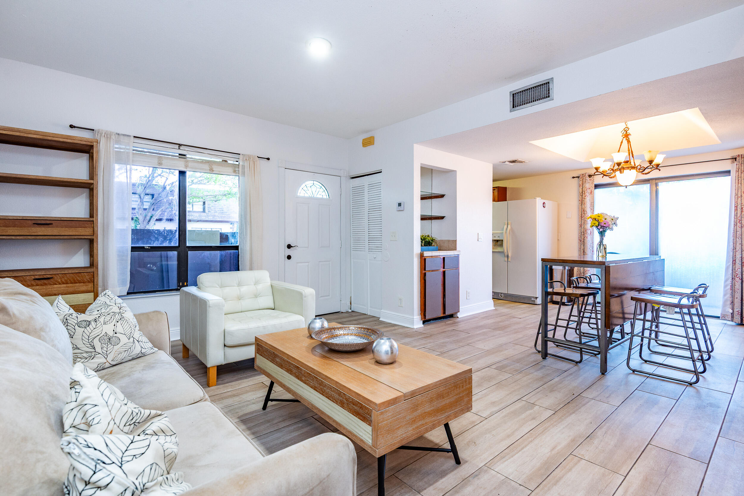 9375 Southwest 61st Way, Unit D Boca Raton, FL 33428 - Photo 12 of 30 a living room with furniture and a table