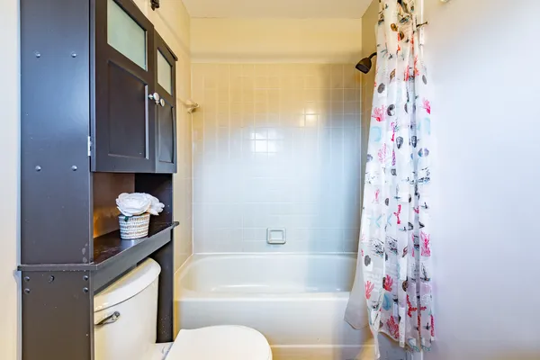 a bathroom with a bathtub and shower