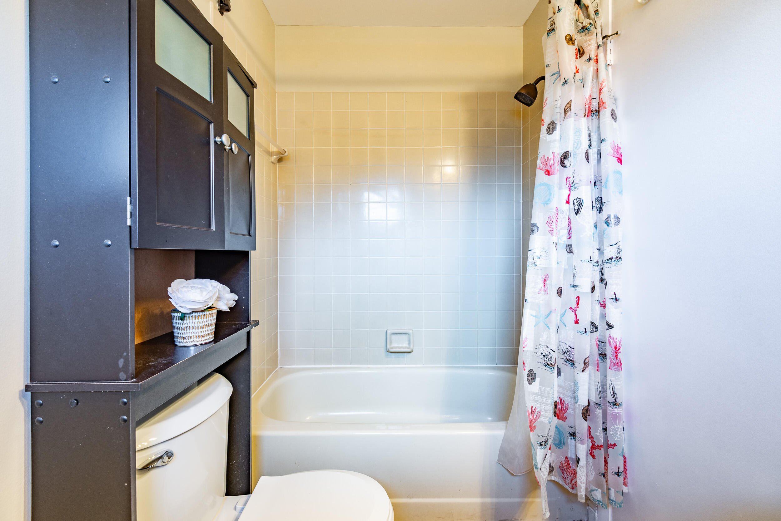 9375 Southwest 61st Way, Unit D Boca Raton, FL 33428 - Photo 20 of 30 a bathroom with a bathtub and shower