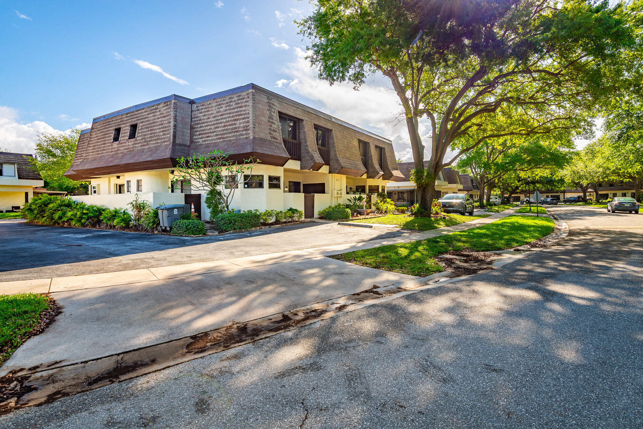 9375 Southwest 61st Way, Unit D Boca Raton, FL 33428 - Photo 2 of 30 a view of a building with a street
