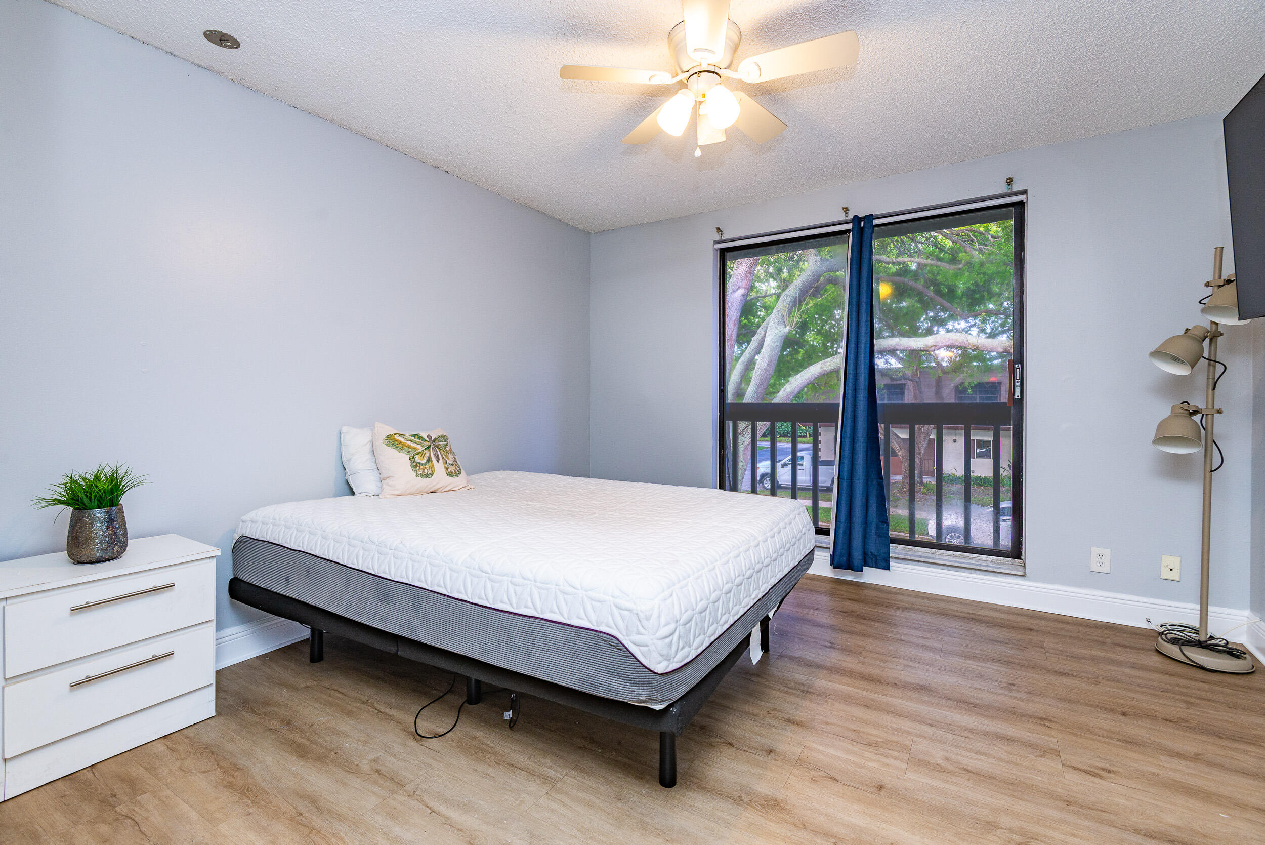 9375 Southwest 61st Way, Unit D Boca Raton, FL 33428 - Photo 25 of 30 a bed sitting in a spacious bedroom next to a window