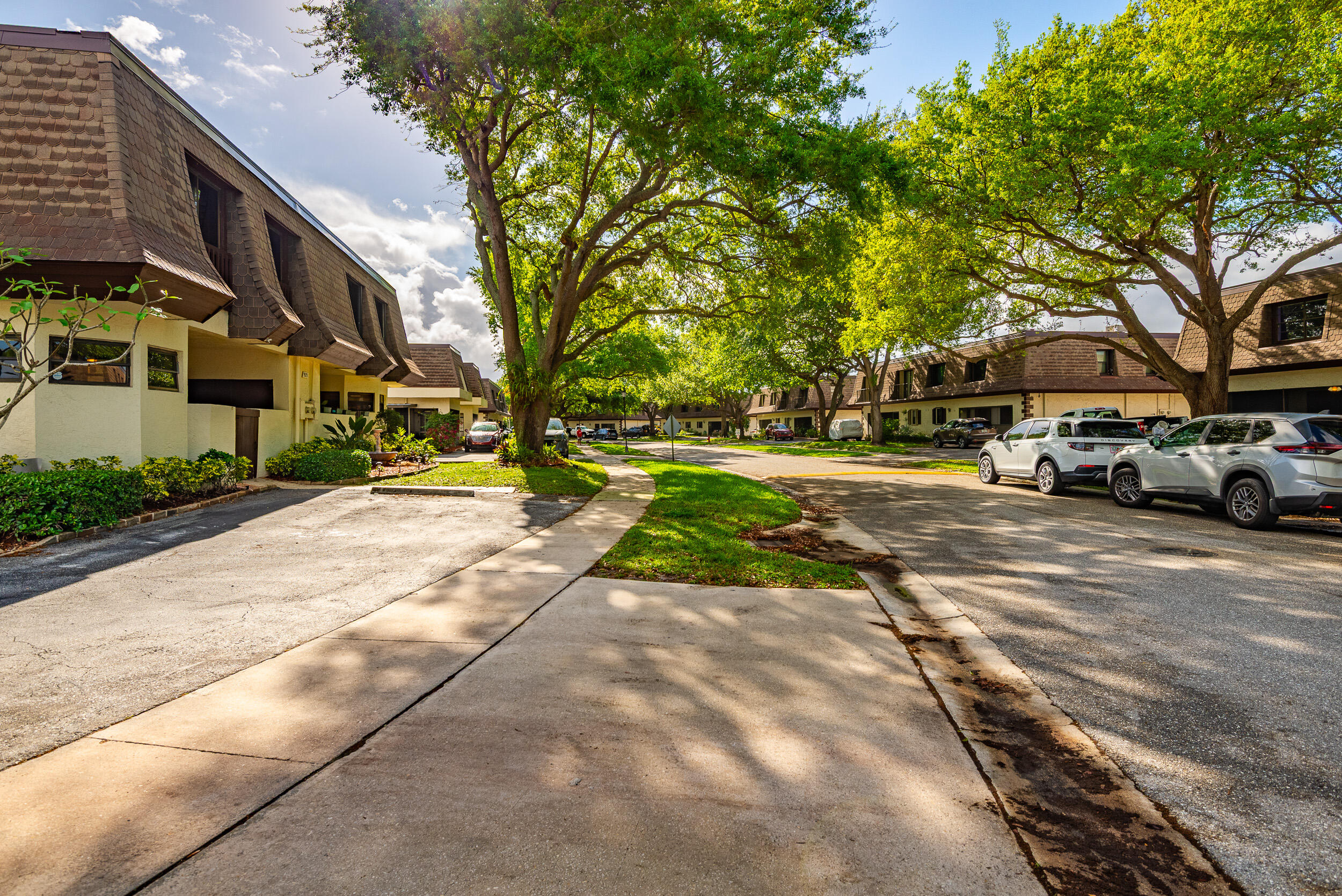 9375 Southwest 61st Way, Unit D Boca Raton, FL 33428 - Photo 28 of 30 a view of street with parked cars