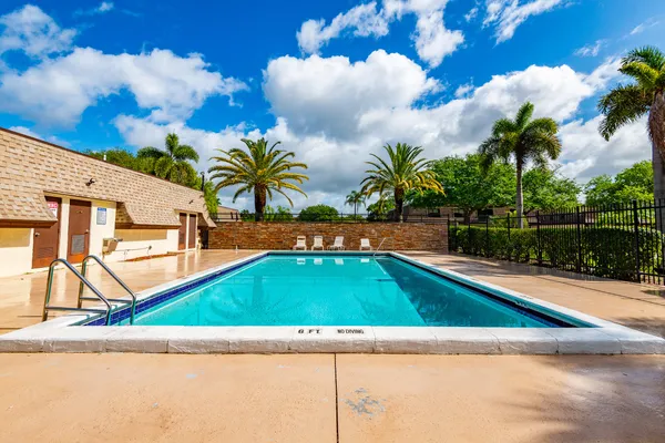 a view of swimming pool with a yard
